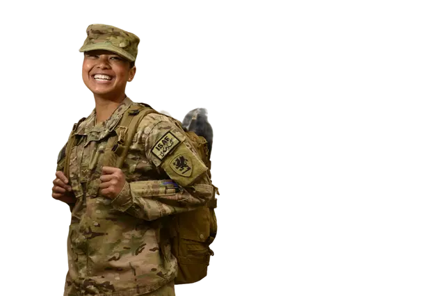 Picture of a smiling veteran with hands behind his back.