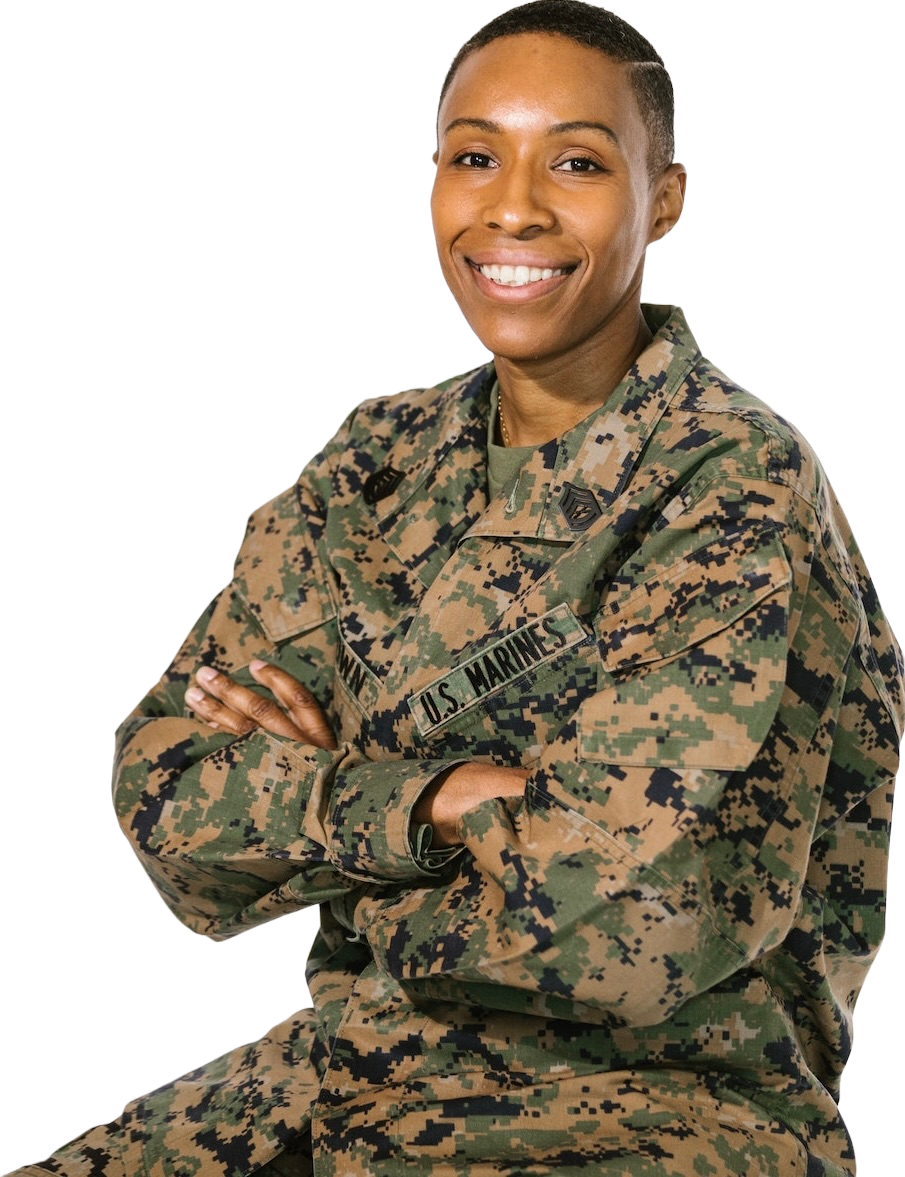 Picture of a veteran sitting with arms crossed smiling