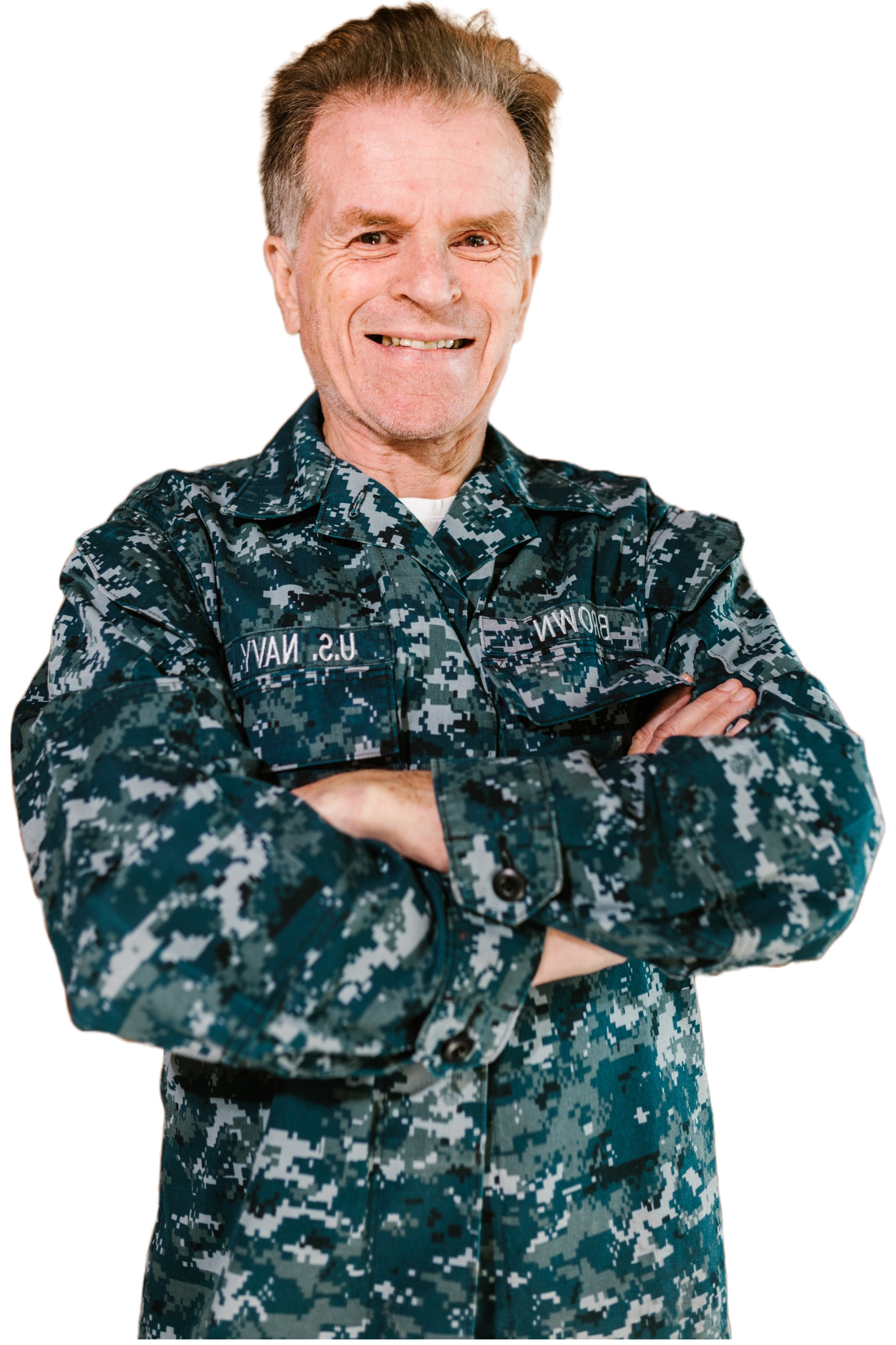 Picture of a smiling Marine veteran with his arms crossed.